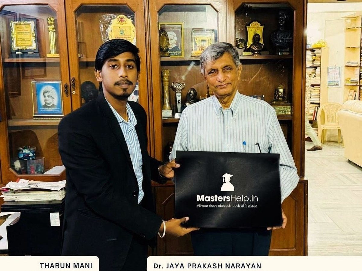Tharun Mani, Founder of MastersHelp.in, with Dr. Jaya Prakash Narayan holding the MastersHelp.in logo
