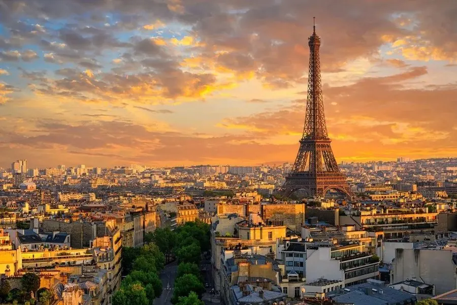 Paris rooftops and the Eiffel Tower at sunset