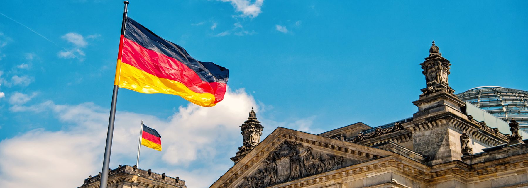 German flag in front of the Reichstag building, Berlin